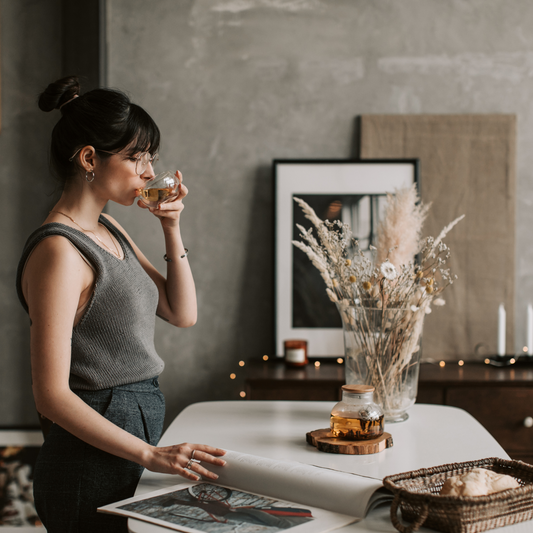 Young woman drinking herbal tea in a calm morning setting